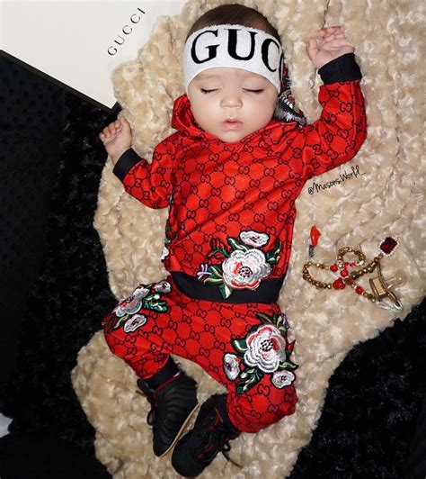 newborn baby wearing Gucci